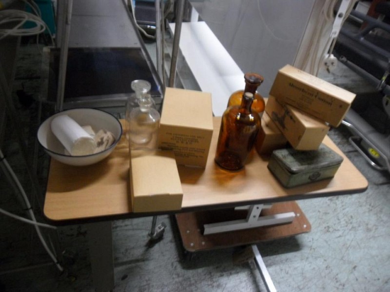 X4 Misc period bottles 6 boxes bandages and a green container 